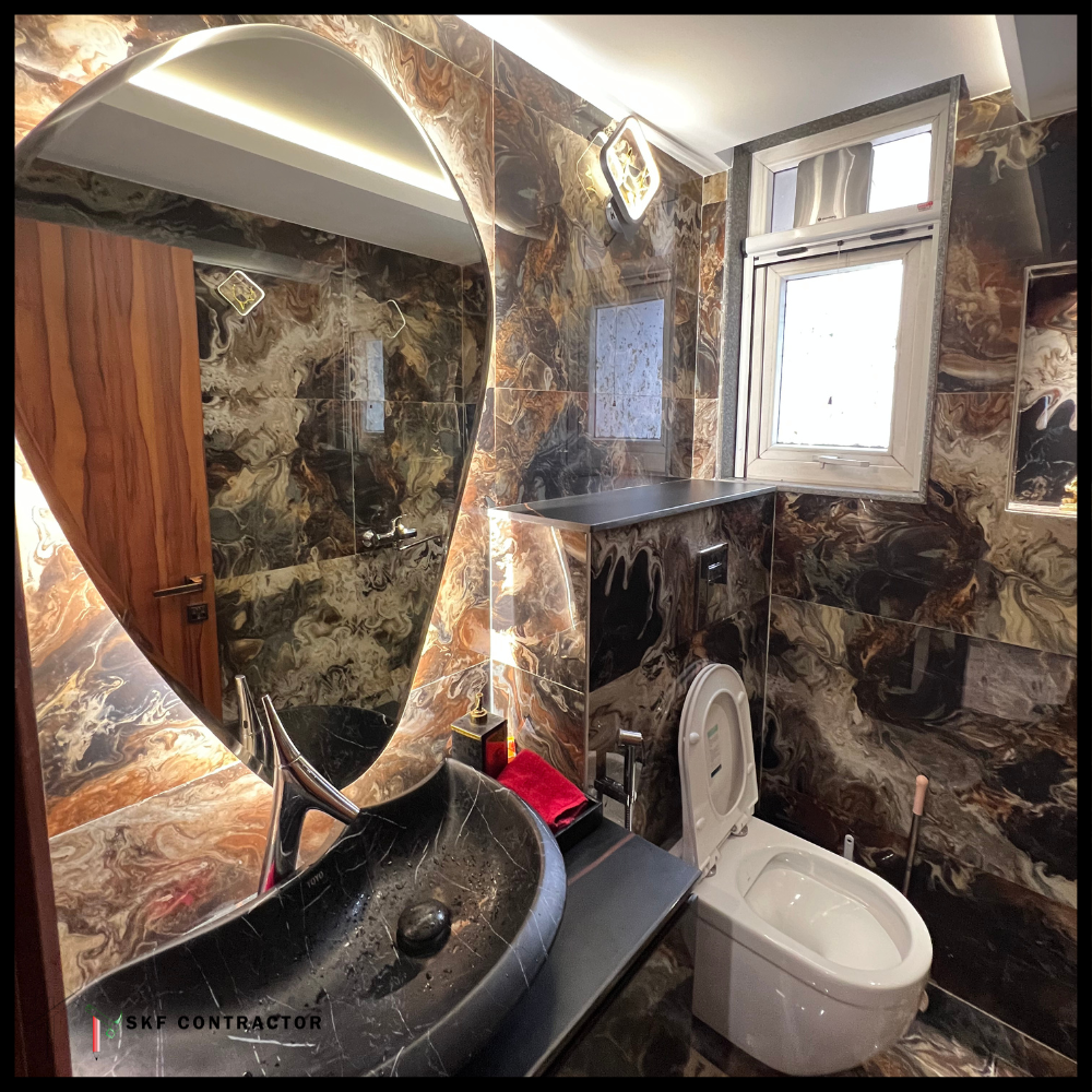 Luxury marble bathroom with black vessel sink, swan faucet, backlit oval mirror, and wall-hung toilet