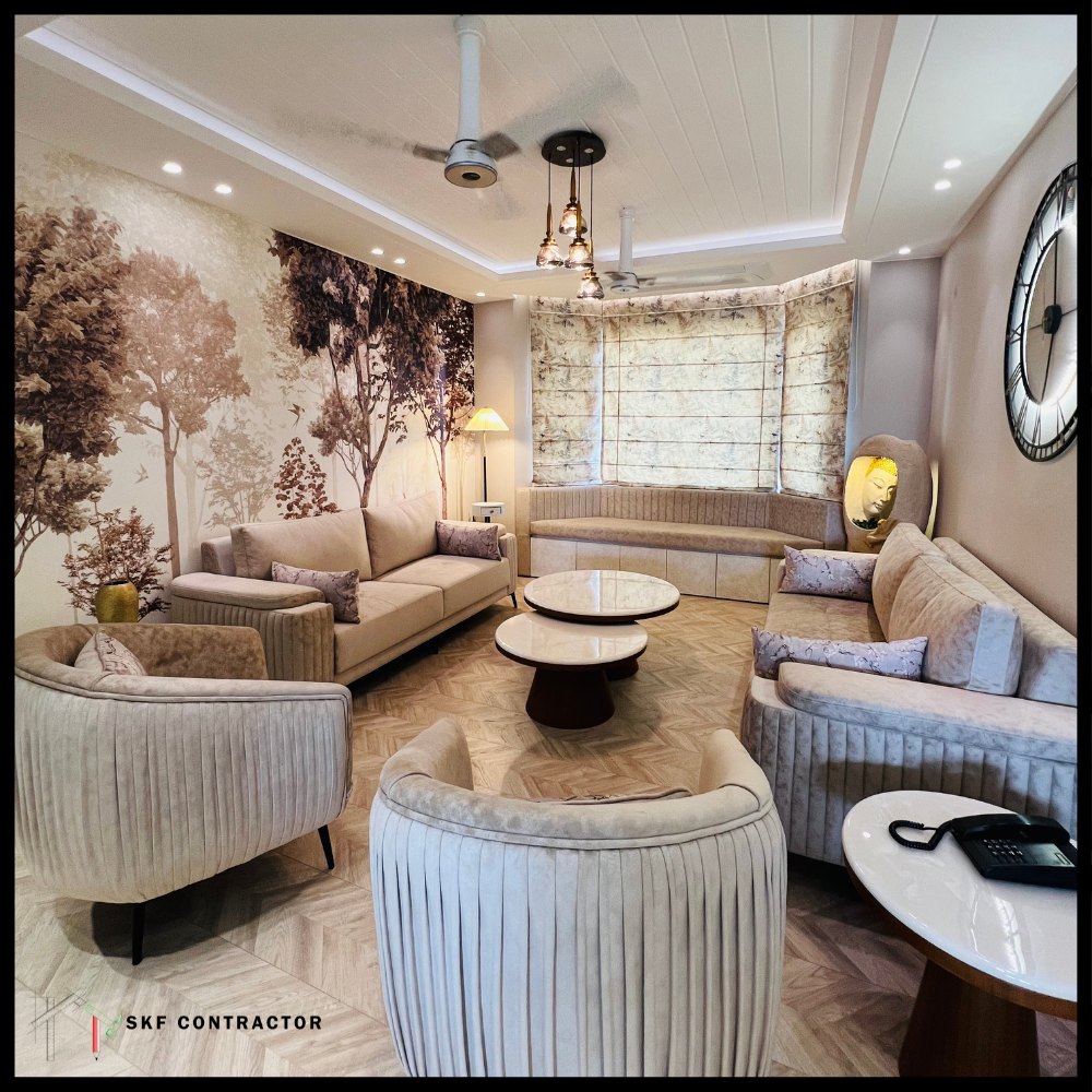 Beige velvet curved sofa set with pleated ottoman, marble coffee table, forest wallpaper, herringbone floor.