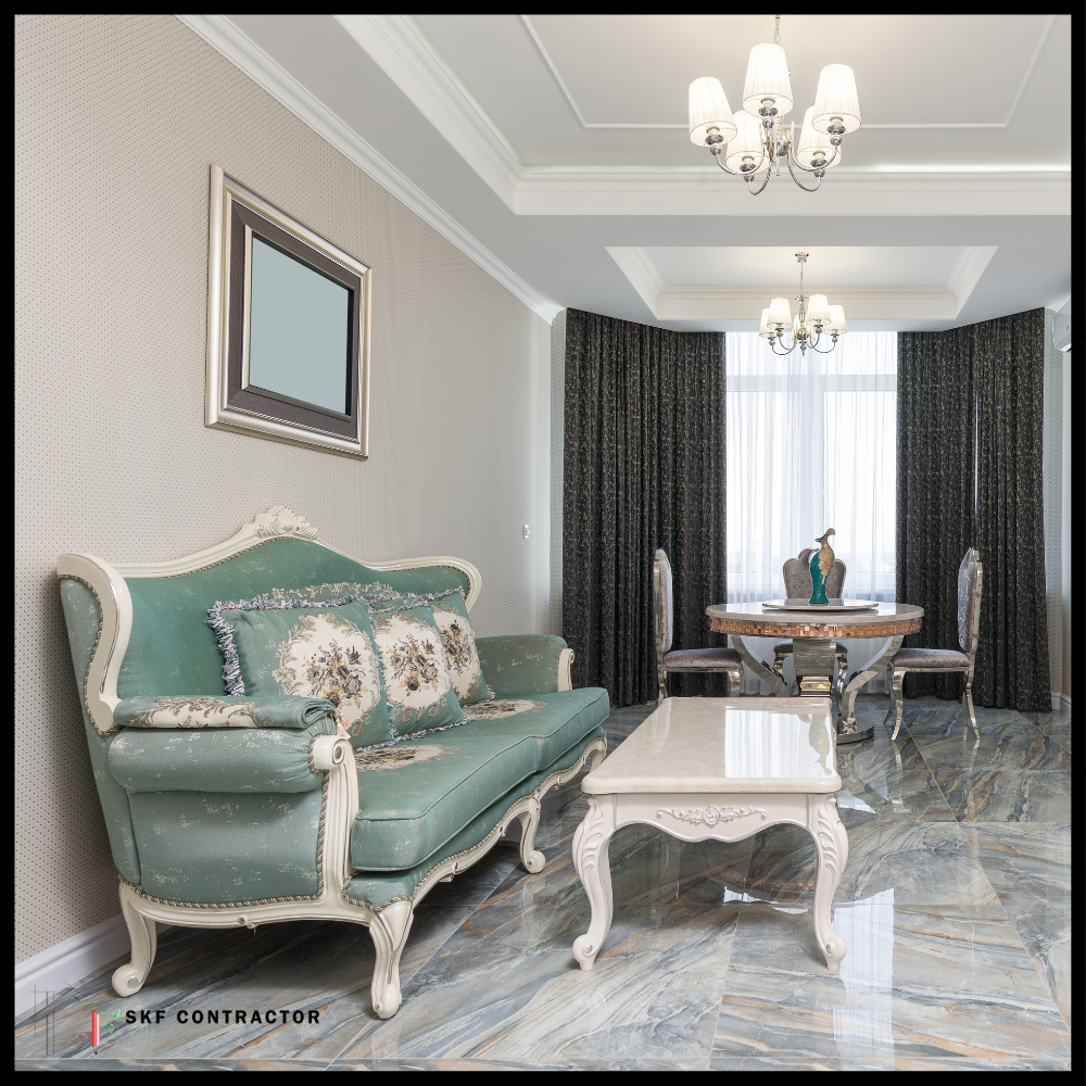Baroque teal sofa with white carved frame, floral cushions, white ornate coffee table, and marble floor.