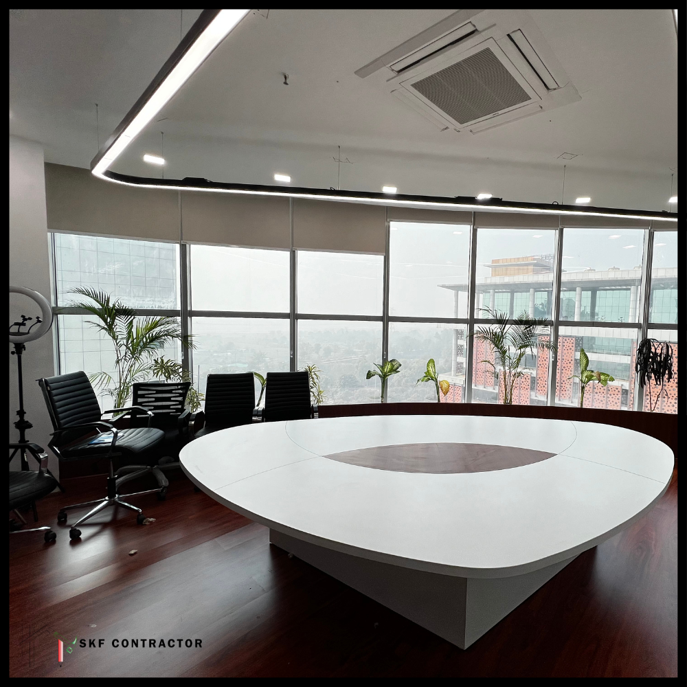 Premium boardroom with white triangular table, black leather chairs, panoramic city windows, and palms.
