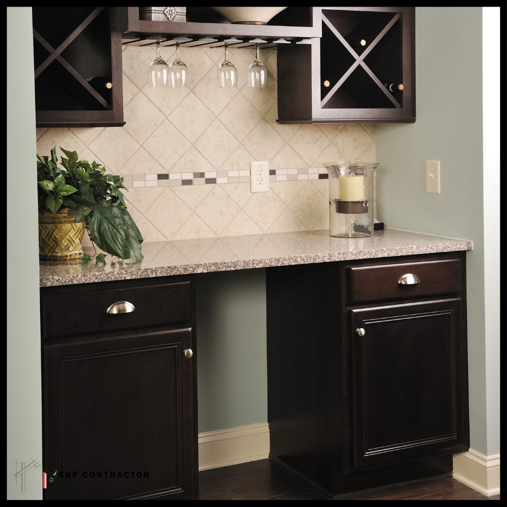 Dark wood bar unit with granite top, X-pattern wine rack, inverted glass holder, and diamond tile backsplash.