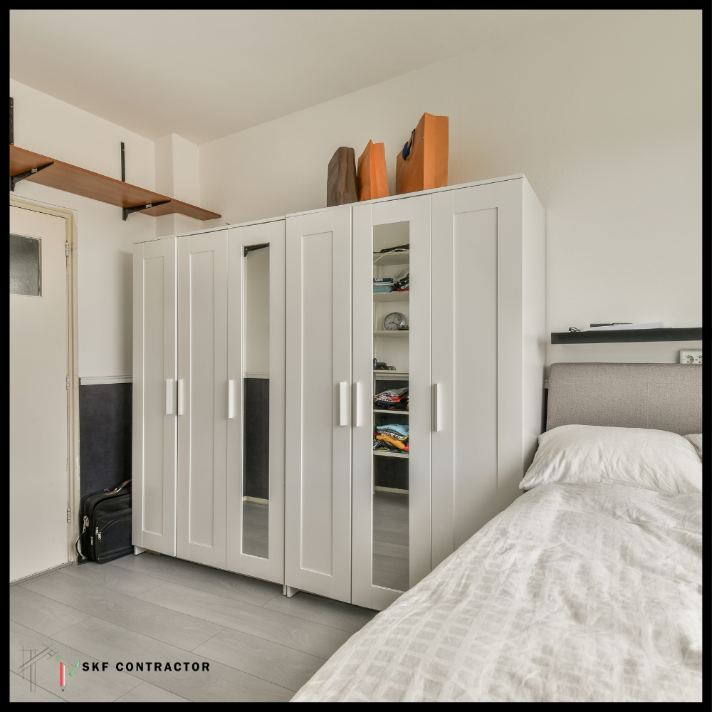 White 4-door bedroom wardrobe with mirror panels and internal shelves.