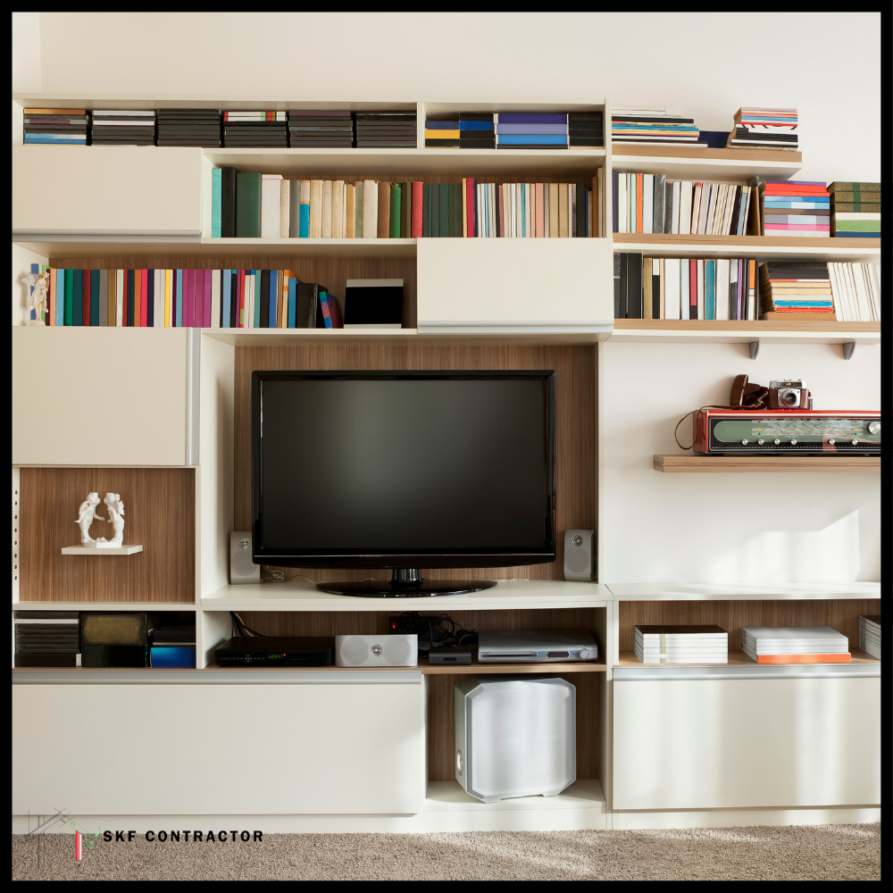 Full-wall TV and bookshelf unit with white cabinets, open shelves and walnut wood back panel.